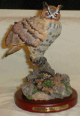 Figurine featuring a Great Horned Owl perched on a branch